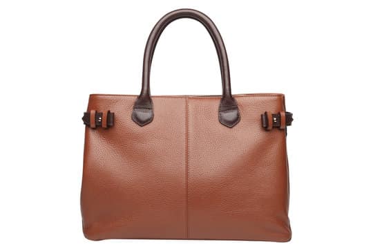 Tan grained leather handbag with rolled top handles and side buckle straps